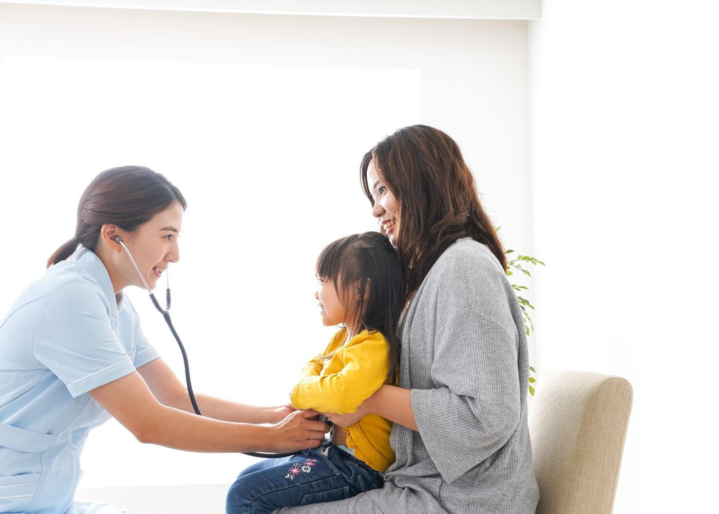 Child getting checked by doctor