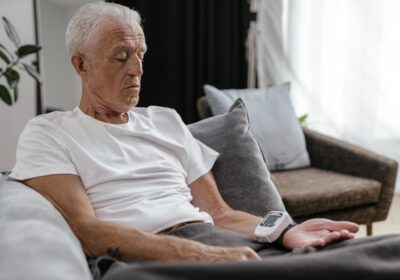 Elderly man checking blood pressure